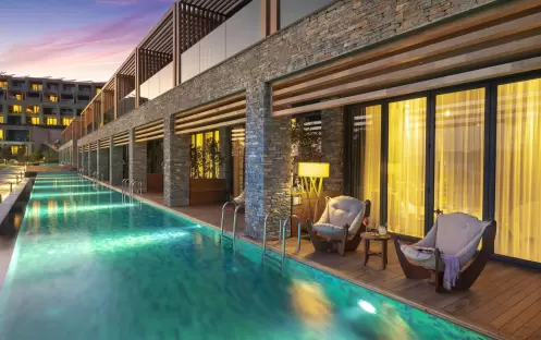 LUJO BODRUM LAGUNA DELUXE ROOM SEA VIEW POOL AT NIGHT